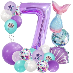Close-up of 7th birthday mermaid balloon set with purple shell and tail foil details