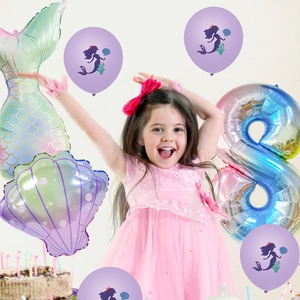 Detail view of mermaid tail balloons and shell foils for an 8th birthday party decoration