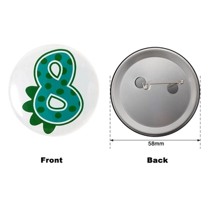 Macro detail of 58mm dinosaur number 8 pin badge showing front and back view
