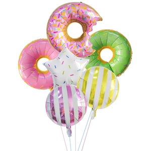 Detail view of colorful donut-shaped foil balloons and striped spheres for party decoration