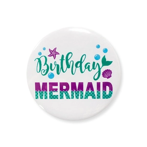 Detail of mermaid birthday tinplate badge showing sea shell and fish scale patterns