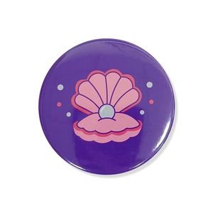 Detail of purple mermaid theme birthday badge with shell and pearl illustration