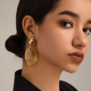 Modern 18K gold-plated irregular hollow wave leaf earrings for women in stylish INS style