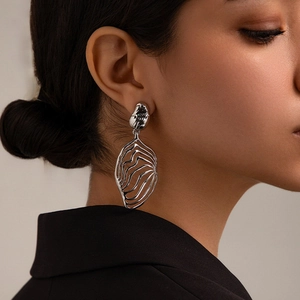 Artistic silver brass leaf earrings with sculpted 18K gold plating for a modern statement
