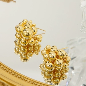 Cluster drop earrings featuring polished 18K gold spheres arranged in a grape bunch design