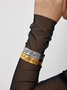 Detailed relief of leaf patterns on 18K gold and silver plated hammered cuff bracelets