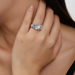 Minimalist silver lava ring with irregular textured finish worn on index finger