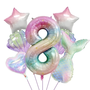 Macro detail of mermaid-themed party balloon set with a rainbow number 8 and shiny tail