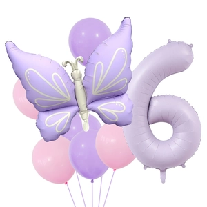 Detail of purple butterfly and number 6 foil balloons set for 6th birthday party decoration