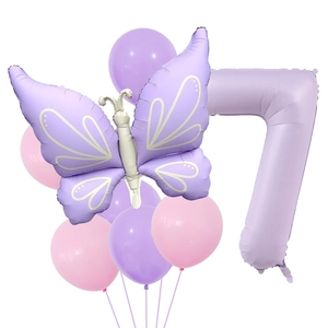 Detail view of purple butterfly and number 7 foil balloons for birthday party decor