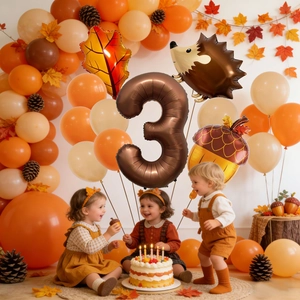 Three kids celebrating at 3rd birthday party with hedgehog and autumn leaf balloons