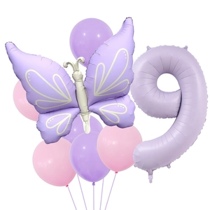 Detail of matte cream purple number 9 and butterfly foil balloons for party decor