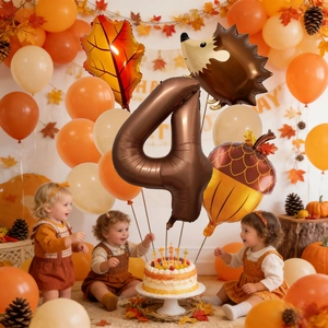 Detail of fall harvest hedgehog and maple leaf balloons for 4th birthday party decor