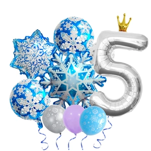 Detail of blue snowflake foil balloons and silver number five balloon for party decor