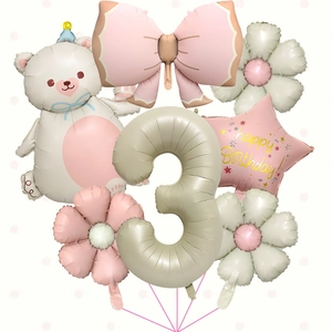 Detail of cream bear and pink bow foil balloons set for girls' 3rd birthday party decor