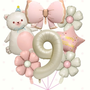 Creamy bear and bow balloon set for 9th birthday party with daisy and star details