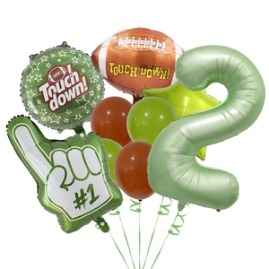 Detail showing American football theme party balloons with green number 2 and touch down logo
