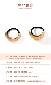 Detail view of gold and silver alloy ponytail holder with elastic hair band properties