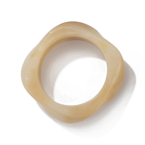 Retro cream beige acrylic bangle with wavy marble pattern for a modern minimalist look