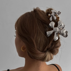 Silver flower hair claws and golden spiral earrings set for elegant women hairstyles