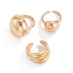 Three-piece gold lava geometric ring set with smooth spherical and layered line designs
