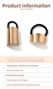 Detailed close-up of metallic alloy hair tie showing polished gold finish and elasticity