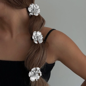 Three-piece silver alloy flower hair rings set for women featuring minimalist metal texture