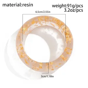 Macro view of geometric resin bangle with gold foil flakes and 91g weight spec