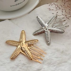 Elegant gold and silver starfish hair comb set for a stylish summer beach wedding look