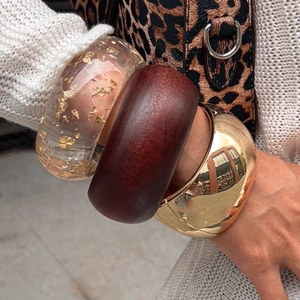 Three-piece stacked wide bangles with gold foil resin, wood, and gold-polished metal