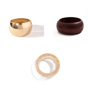 Three wide bangle set with gold finish, dark wood grain, and gold foil resin styles
