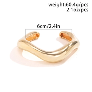 Golden irregular wavy geometric alloy cuff bracelet with polished finish and open design