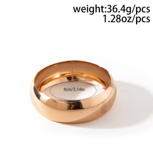 Detail shot showing 8cm diameter and 36.4g weight for the gold wide geometric bangle