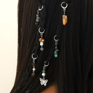Bohemian hair braid rings with butterfly charms and natural stones on dark braided hair