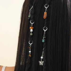 Bohemian hair rings set with butterfly charms and colorful stones on braided hair