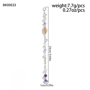 Detailed view of handmade beaded hair chain with natural conch shell and purple beads