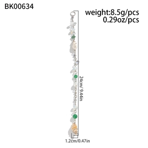 Detailed view of 24cm beach hair chain with green beads, pearls and a conch shell charm