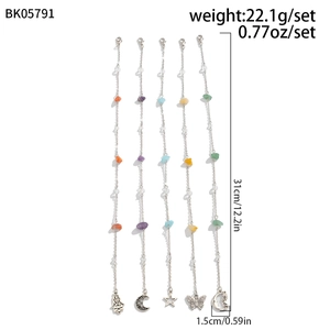 Detailed view of bohemian anklet set with colorful stones and metal charm pendants