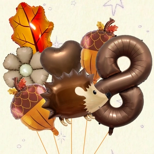 Detail of autumn hedgehog balloon set with maple leaf and number eight for harvest party
