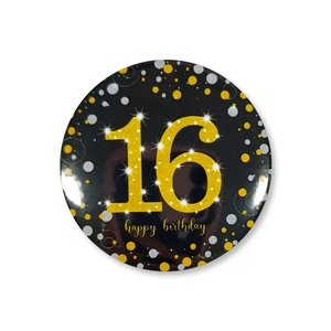 Macro detail of 58mm black and gold birthday badge with glitter number 16 design
