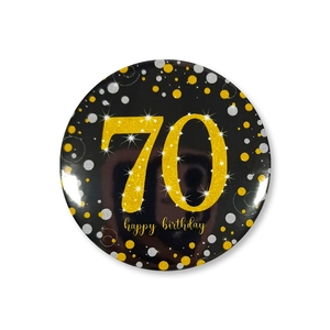Close-up of 58mm black and gold birthday badge featuring sparkling number 70 and dots