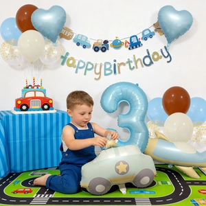 Transportation theme 3rd birthday party set with police car balloons and banner