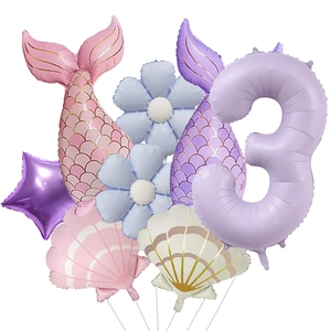 Detail view of mermaid theme balloon set with lavender number 3 and shell foil balloons