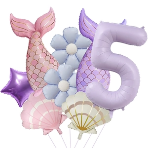 Detail of mermaid party balloon set with scales texture and pastel shell shapes