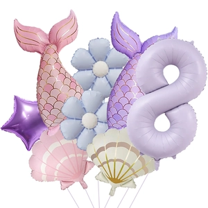 Detail of mermaid party balloon set with cream purple number 8 and shiny tail fins