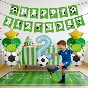 Soccer themed 2nd birthday party set with football balloons and green happy birthday banner