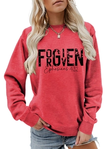 Close-up of Forgiven Ephesians 4:32 text print on red long-sleeved cotton sweatshirt