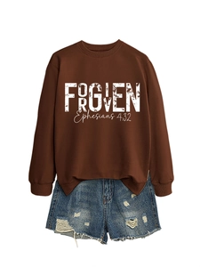 Detail of brown Forgiven Ephesians sweatshirt with distressed denim shorts on white background
