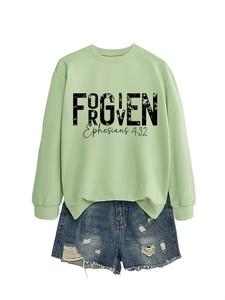 Detail of sage green sweatshirt with black Forgiven Ephesians 4:32 print and raw hem finish