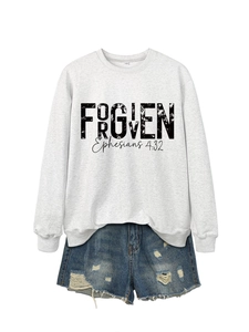Detail of grey crewneck sweatshirt with Forgiven print and distressed denim shorts